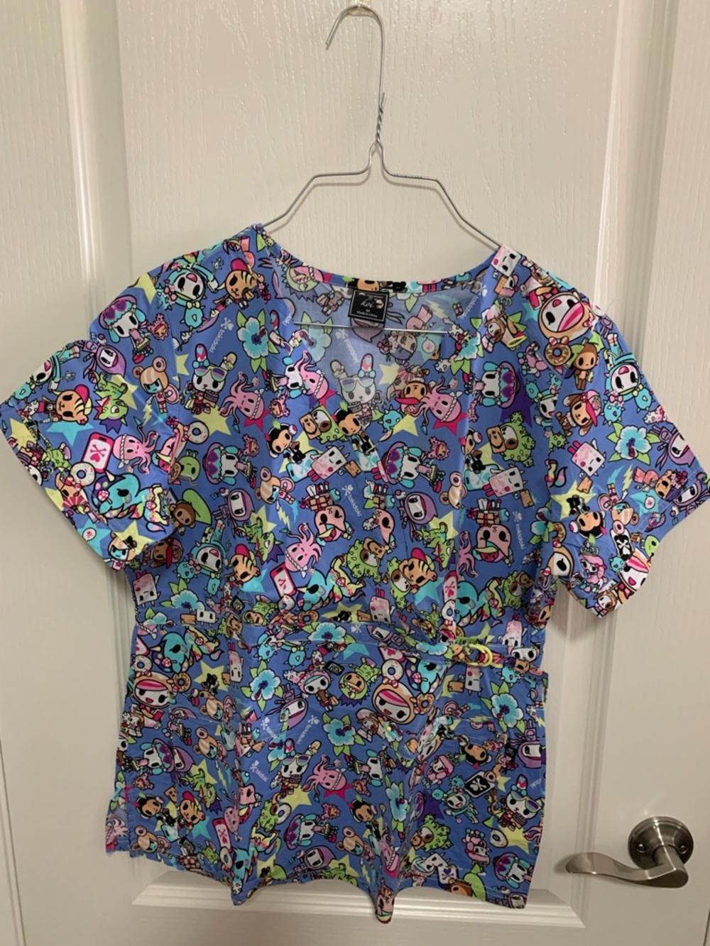 koi Light Blue Short Sleeve Scrub Top with Multicolor Character Print